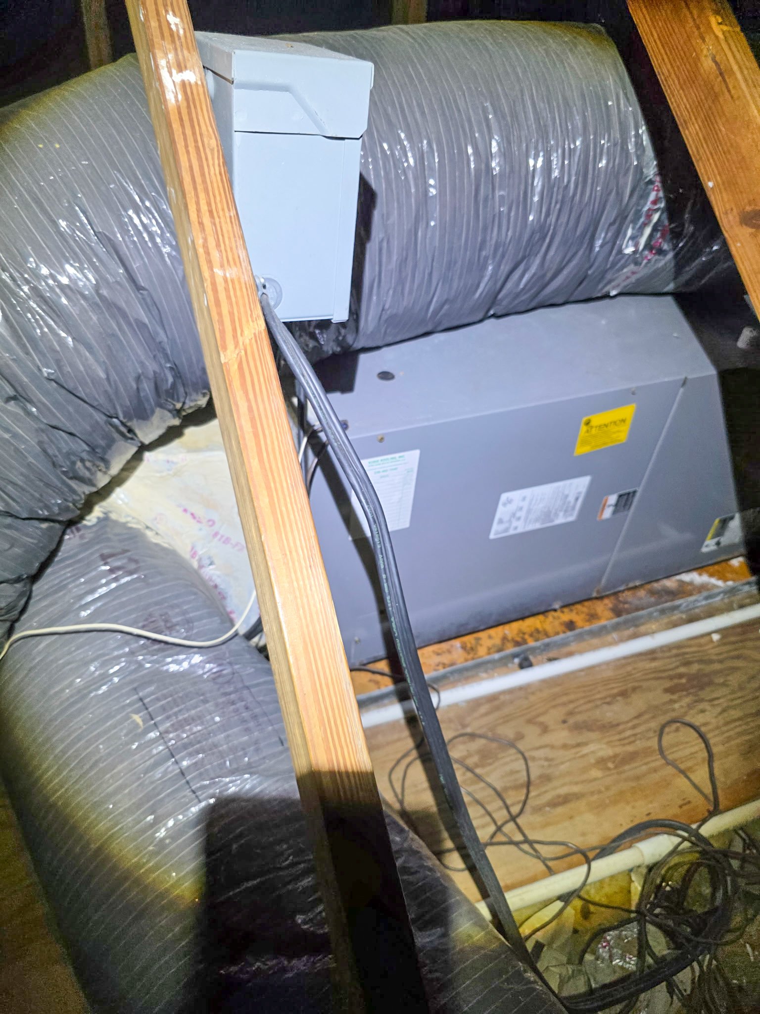 New Lennox air handler installed on a raised stand in a residential closet in Punta Gorda, FL